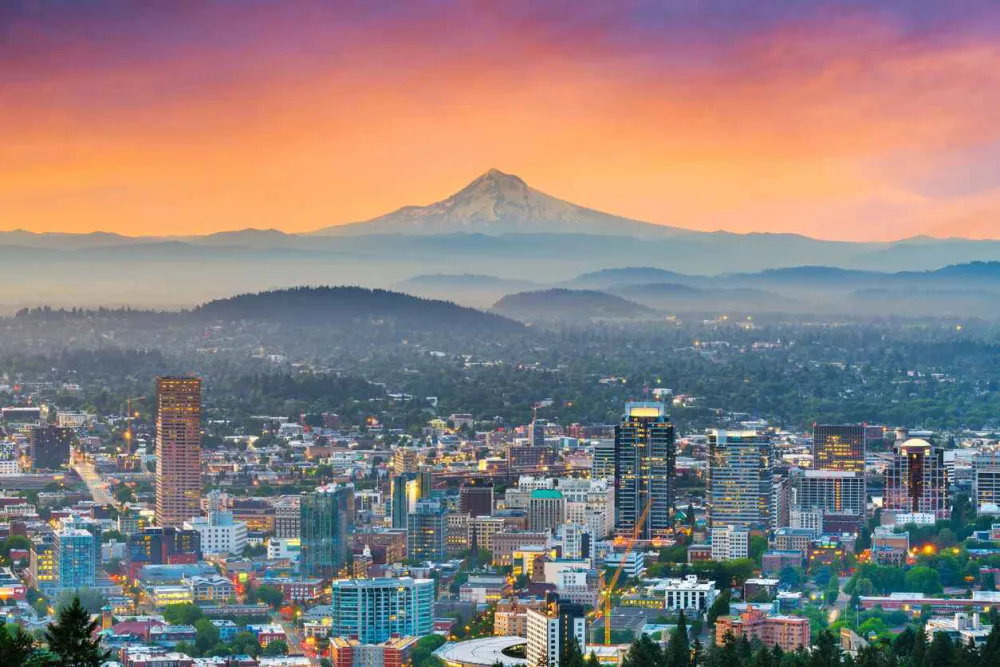 Skyline of Portland, OR, with Mount Hood in the background.